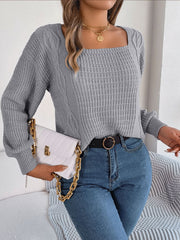 Light Gray cable knit sweater with square neckline and textured sleeves.