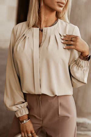 Khaki pleated yoke blouse with button detail and cuffed sleeves