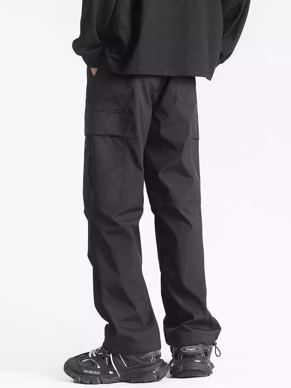 Men's black relaxed fit cargo sweatpants with ankle drawstring and multiple pockets.