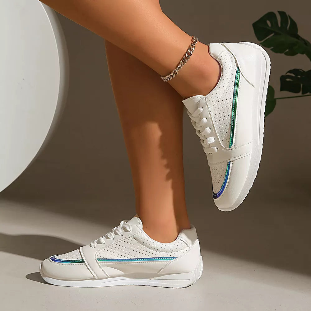 White lace-up sneakers with perforated detail and iridescent green and blue stripe accents.