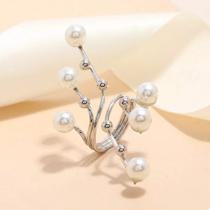Silver bypass ring with faux pearls and silver bead accents.