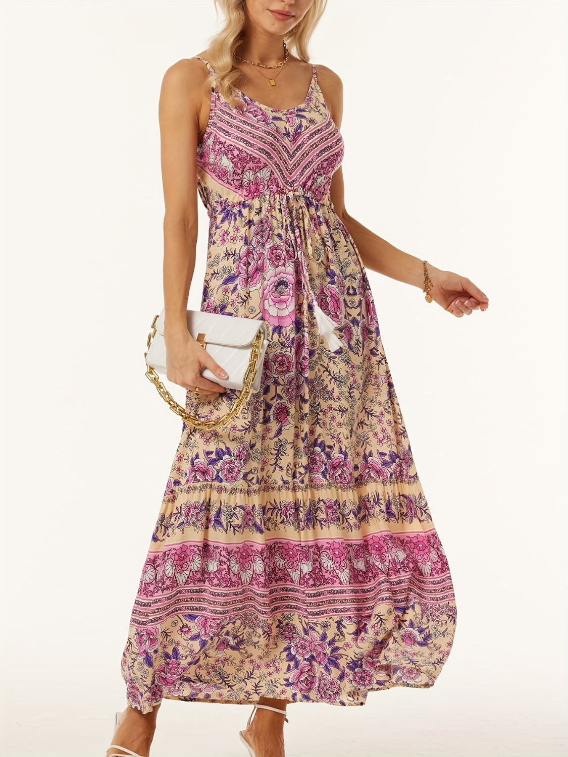 Bohemian floral maxi dress with adjustable waist and tiered skirt in pink and purple floral print on beige.