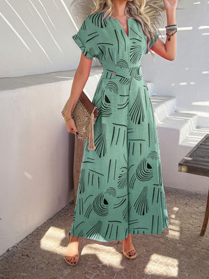 Geometric print wide-leg jumpsuit in Gum Leaf with short sleeves and V-neck.
