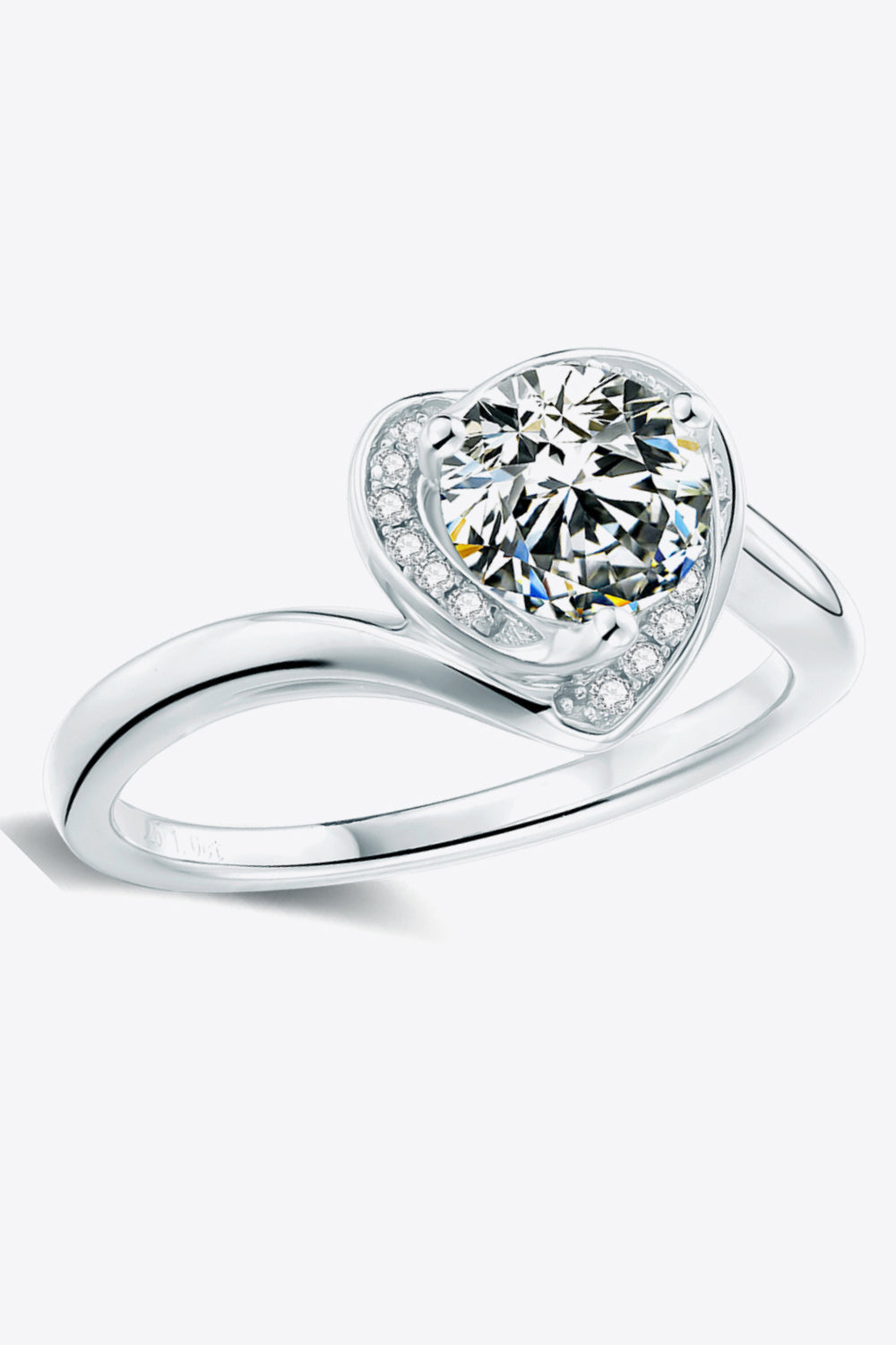 Silver heart halo moissanite ring with a round center stone and pavé accents.