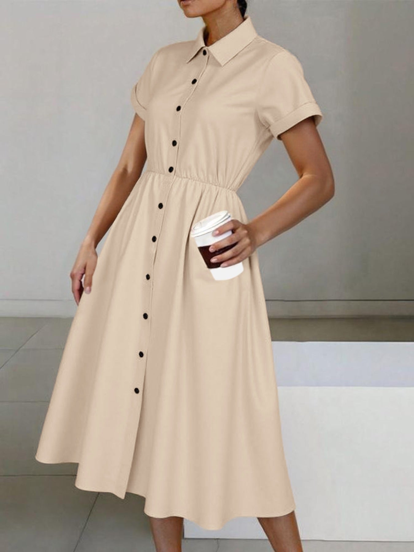 Beige button-down midi shirt dress with cinched waist, pockets, and classic collar.