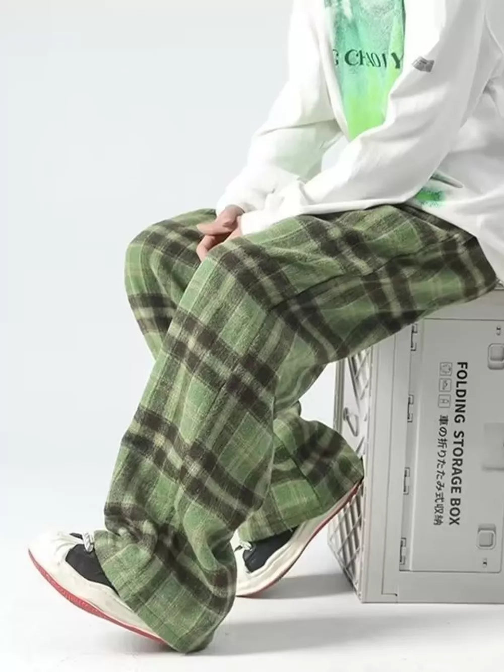 Green plaid wide-leg sweatpants with a relaxed fit.
