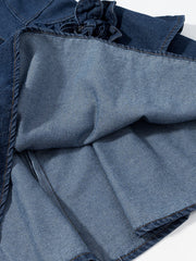 Denim mini dress with floral ruffle detail and frayed hem.