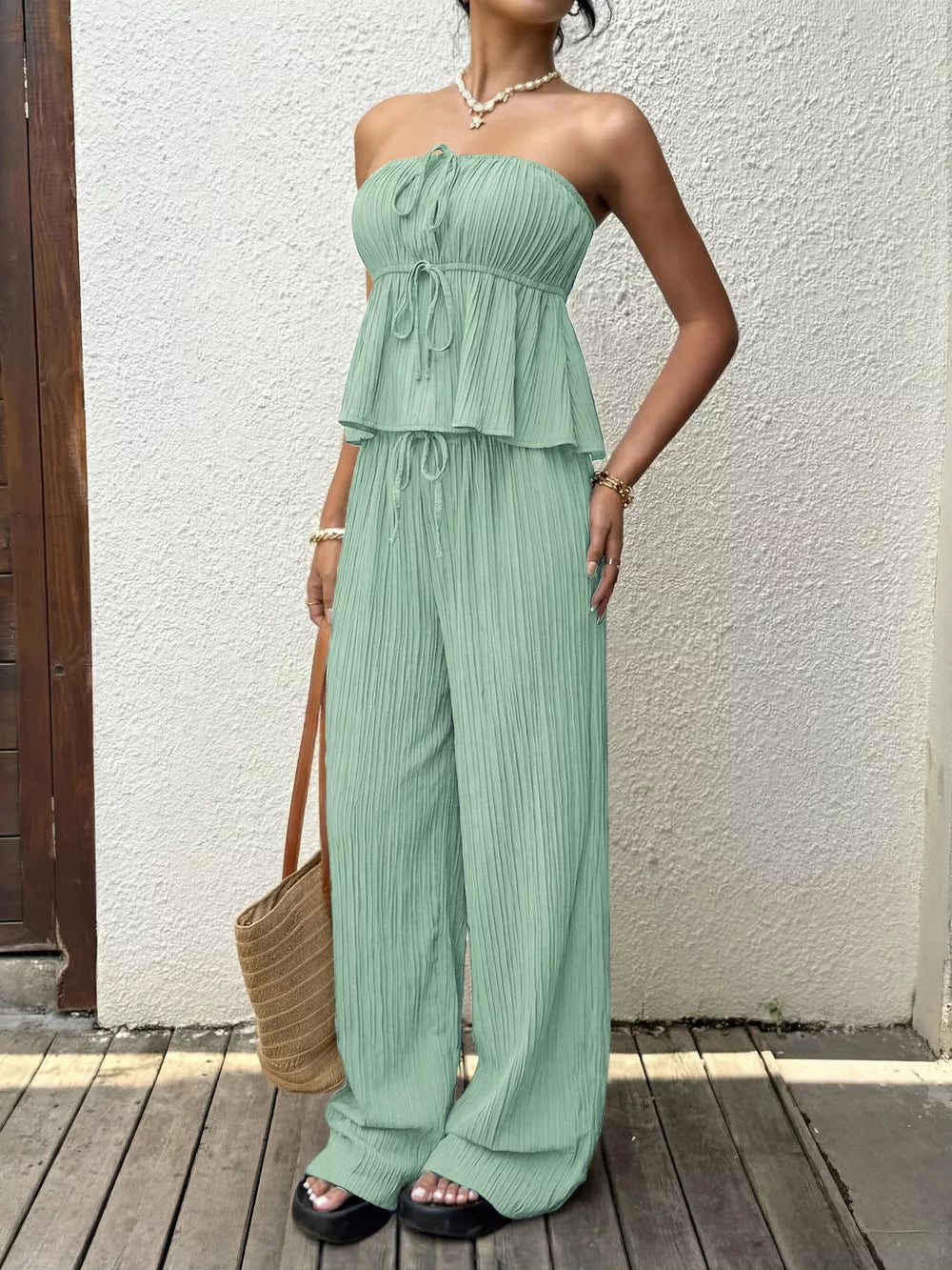 Pleated tube top and wide-leg pants set in Gum Leaf green with drawstring details.