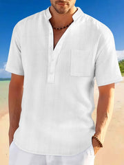 White textured linen Henley shirt with mandarin collar and chest pocket.