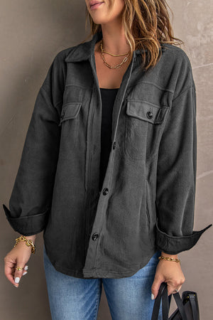 Charcoal fleece shirt jacket with patch pockets and button front.