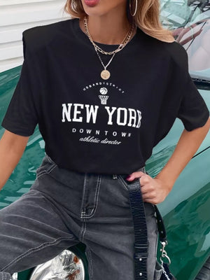Black graphic t-shirt with New York Downtown print, round neck, and padded shoulders.
