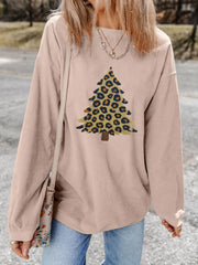 Eggshell corded sweatshirt with leopard print Christmas tree graphic.
