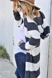 Chunky knit hooded cardigan with wide grey and white stripes.