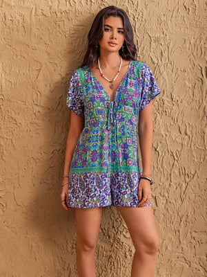 Floral tie-front V-neck romper with short sleeves and bohemian print.