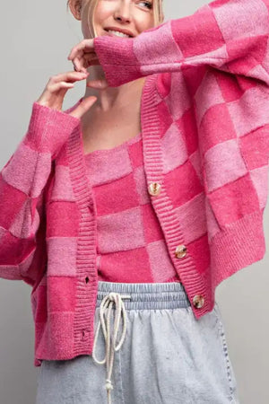 Pink checkerboard knit cardigan with matching tank top and button front.
