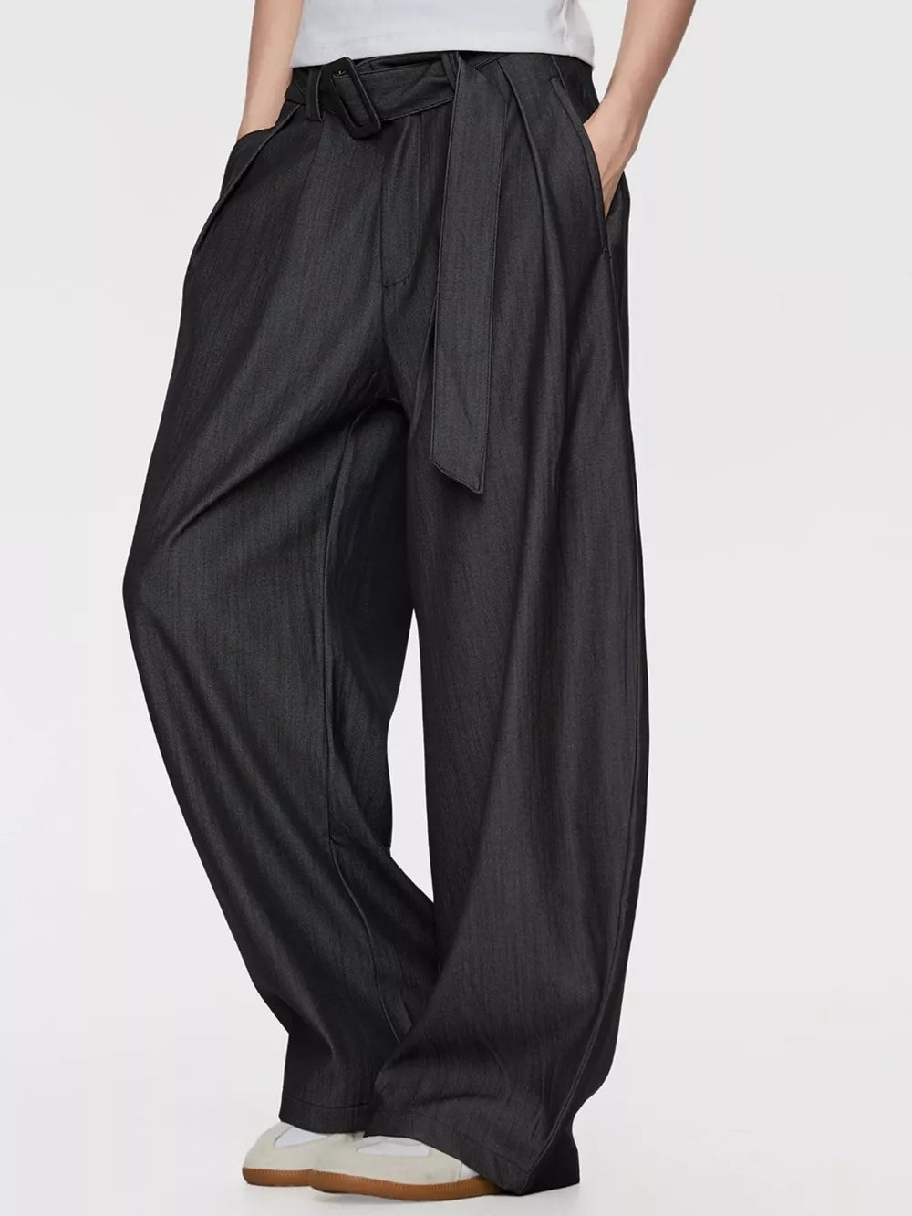 Men's dark gray wide-leg dress pants with a tie belt and pleats.