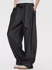 Men's dark gray wide-leg dress pants with a tie belt and pleats.