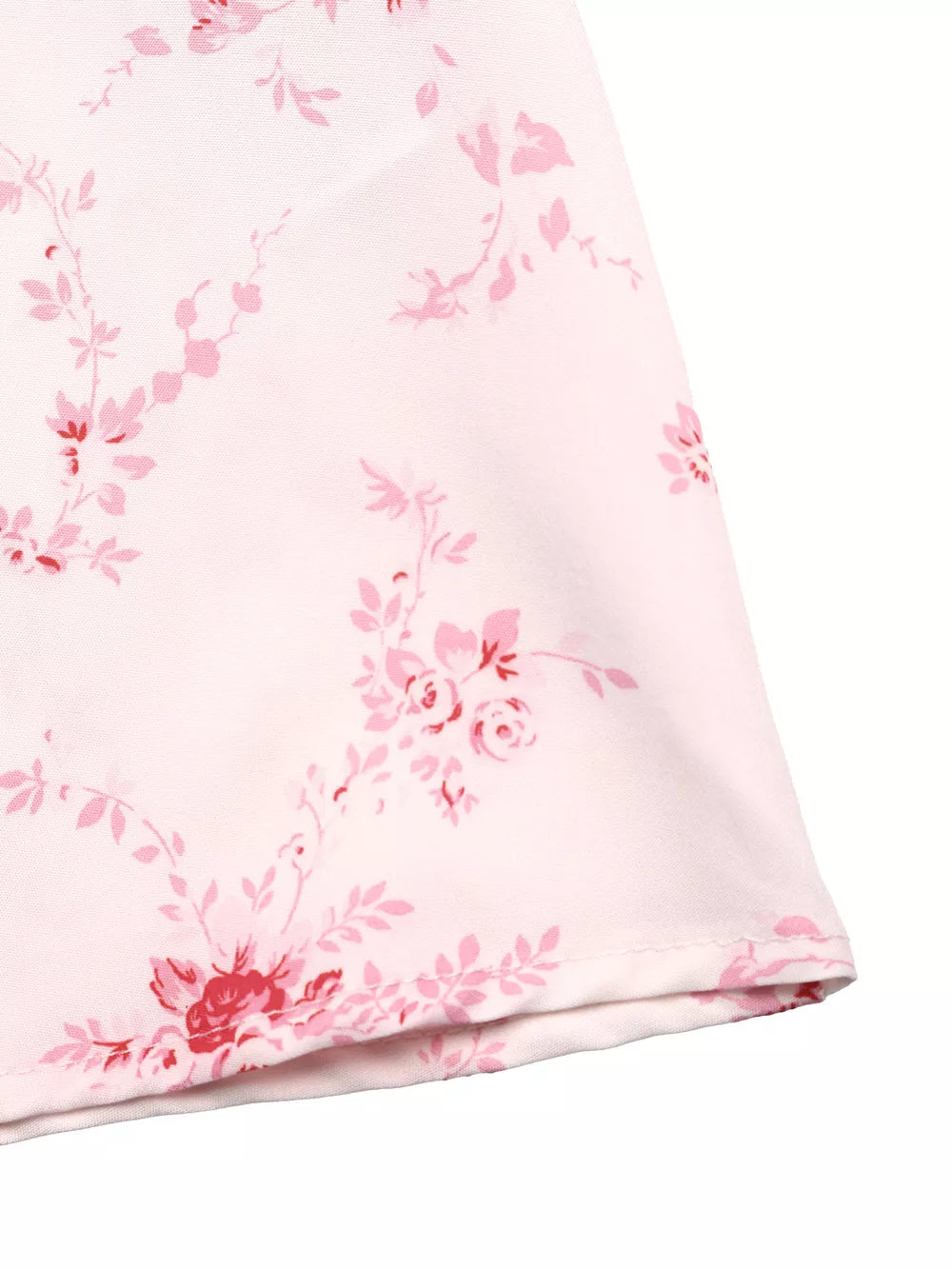 Romantic floral cami dress in pink with delicate rose print and frill detail.