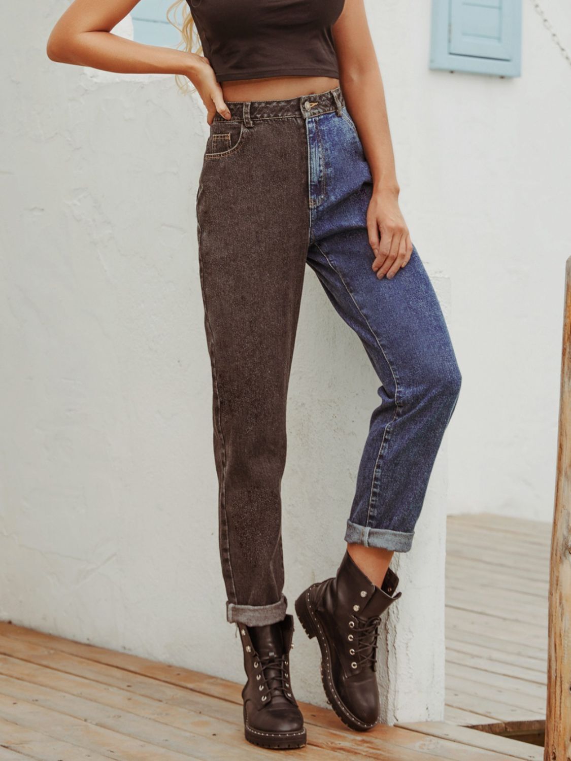 Split-tone straight leg jeans in medium wash and dark wash denim, cuffed hem