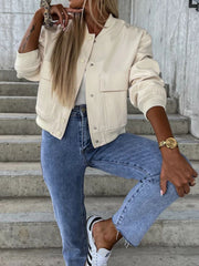 Beige faux leather bomber jacket with snap front, chest pockets, and ribbed cuffs.