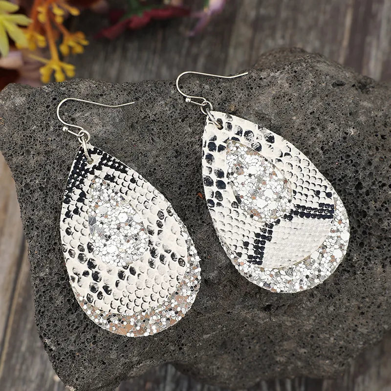 Python print and glitter drop earrings in silver with layered teardrop shape.