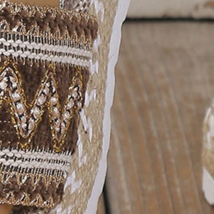 Embroidered espadrille platform slide with zigzag pattern in mocha and gold.