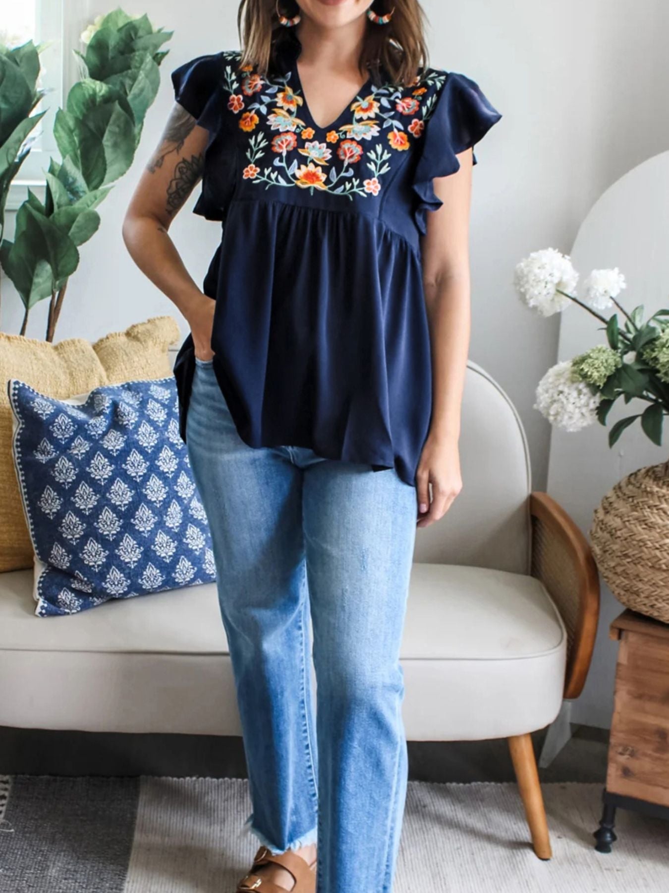 Navy embroidered floral ruffle sleeve blouse with V-neck