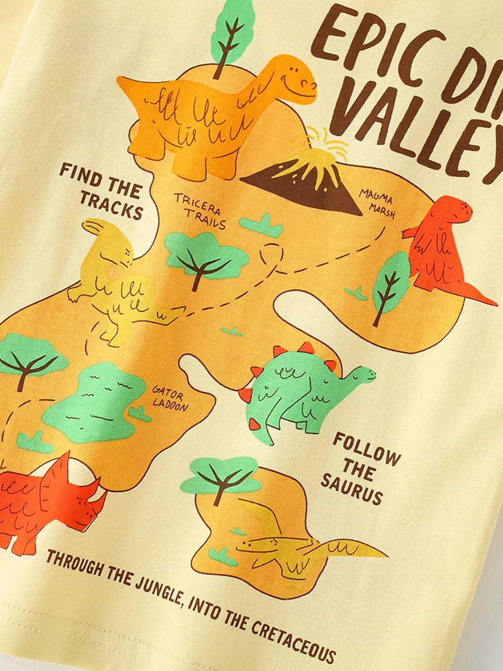 Baby t-shirt in light yellow cotton with a fun dinosaur map graphic and text.