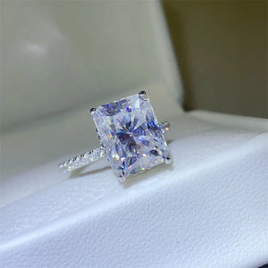Radiant cut moissanite ring with pavé band in silver.