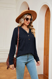 Navy textured henley hoodie with drop shoulder and button neckline.