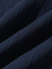 Blue casual cargo pants fabric detail with visible texture and folds.