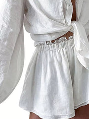 White linen-look two-piece set with tie-front shirt and ruffled elastic waist shorts