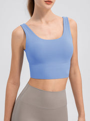 Light blue performance crop top with scoop neck and wide band.