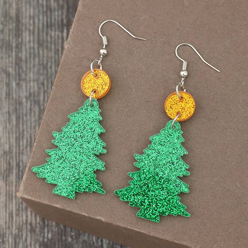 Glittering green acrylic Christmas tree drop earrings with orange glitter discs.