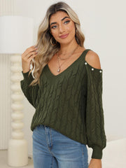 Army green cable knit sweater with cold shoulder detail and button accents.
