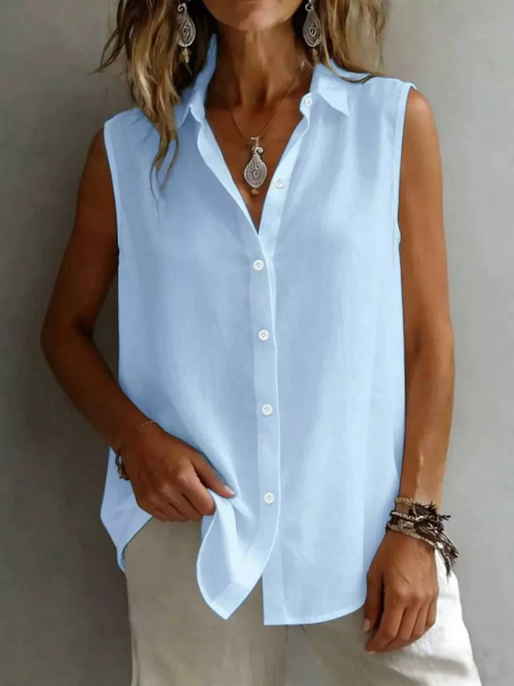 Light blue sleeveless button-up shirt with a classic collar and relaxed fit.