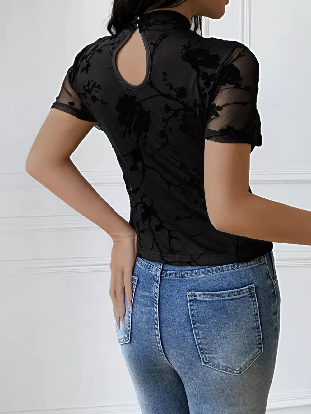 Black sheer burnout floral maternity t-shirt with mandarin collar and keyhole cutout back.
