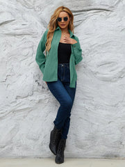 Peacock Green corduroy button-up shirt with collar and cuffs, worn open over a black tank top.