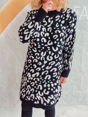 Black leopard print knit mini dress with long sleeves and crew neck.