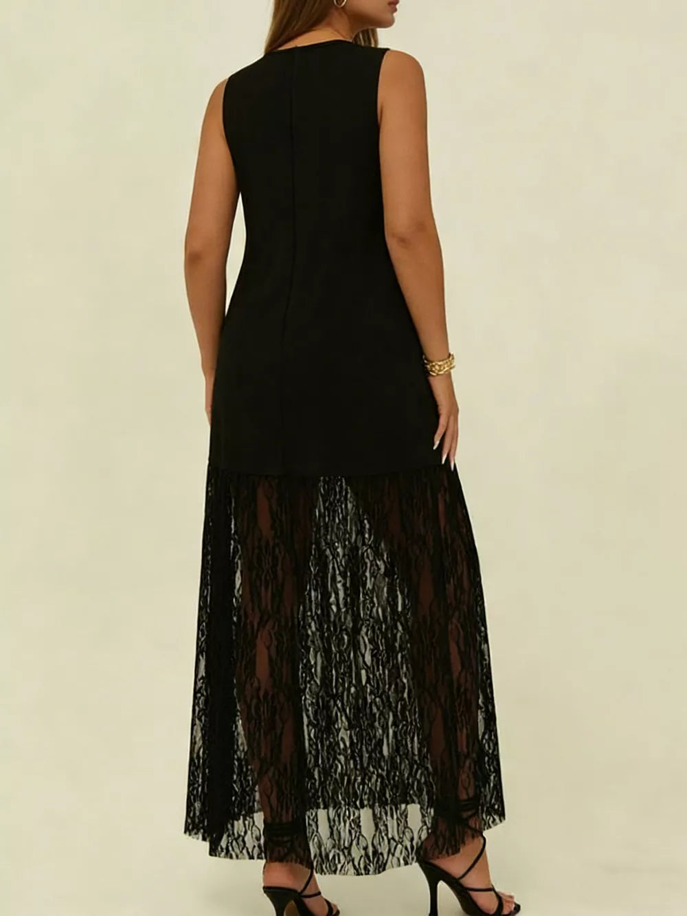 Black plus size maxi dress with sleeveless bodice and sheer lace skirt.