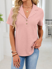 Pink waffle knit button placket t-shirt with a collared neckline and short sleeves.