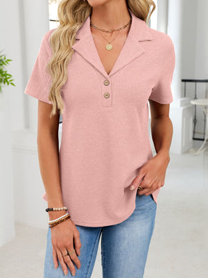 Pink waffle knit button placket t-shirt with a collared neckline and short sleeves.