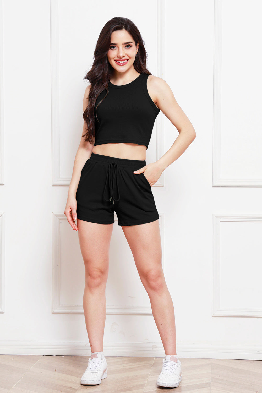 Black ribbed tank top and drawstring shorts set with a casual fit.