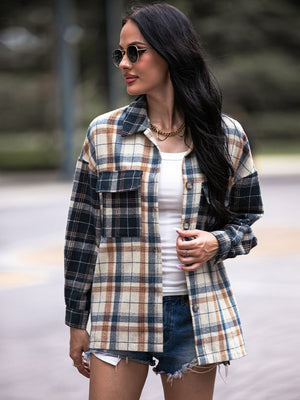Colorblock plaid utility shacket in navy with button-front, chest pockets, and collared neckline.