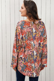Painterly floral oversized blouse with flared sleeves and a V-neck.