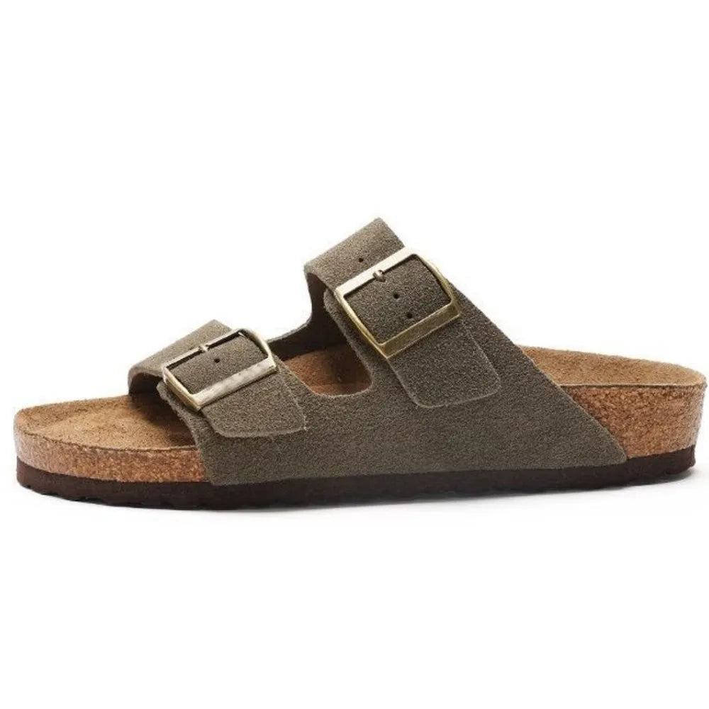 Army green suede slide sandals with adjustable buckle straps and cork sole.