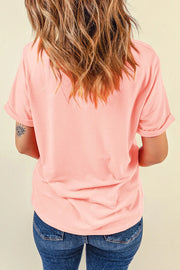 Blush pink t-shirt with rolled short sleeves and a graphic detail on the left arm.