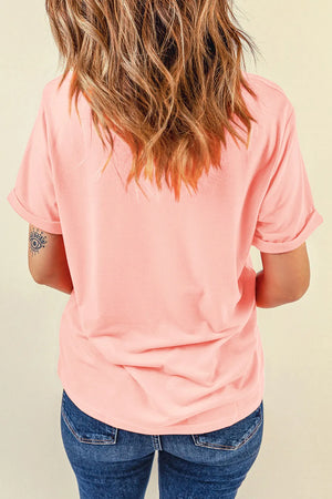 Blush pink t-shirt with rolled short sleeves and a graphic detail on the left arm.