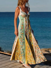 Botanical print sweetheart maxi dress with a sweetheart neckline and a flowing skirt.