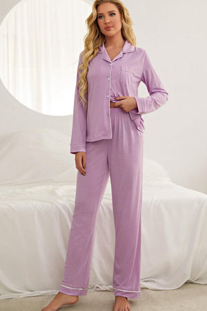 Purple pajama set with contrast piping, long sleeves, button-up top, and wide-leg pants.